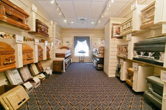 There are many different types of coffins in this room.