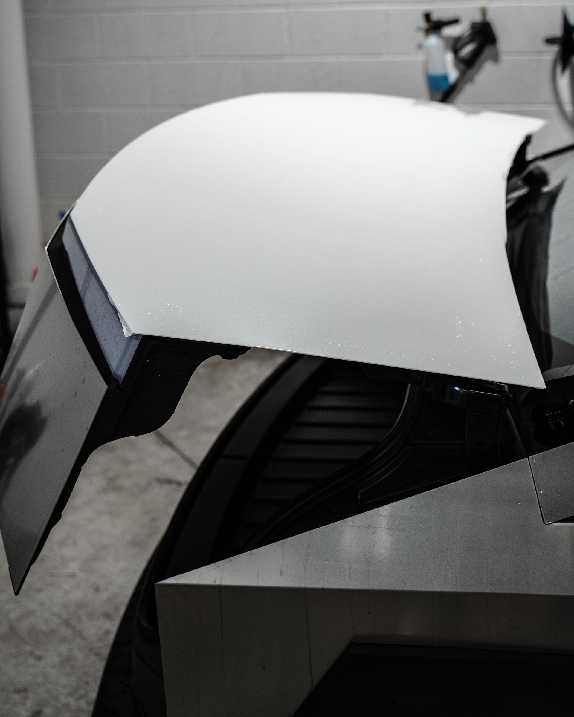 A white piece of paper is sitting on top of a black object