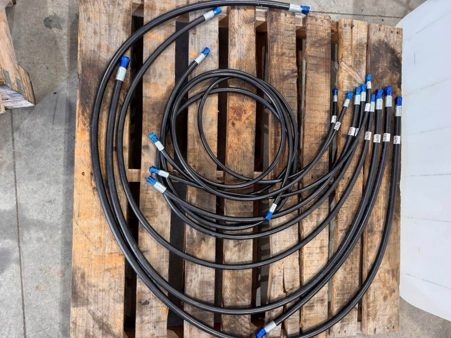A Bunch Of Hose Sitting On Top Of A Wooden Pallet — HI PSI Hydraulics in Wauchope, NSW