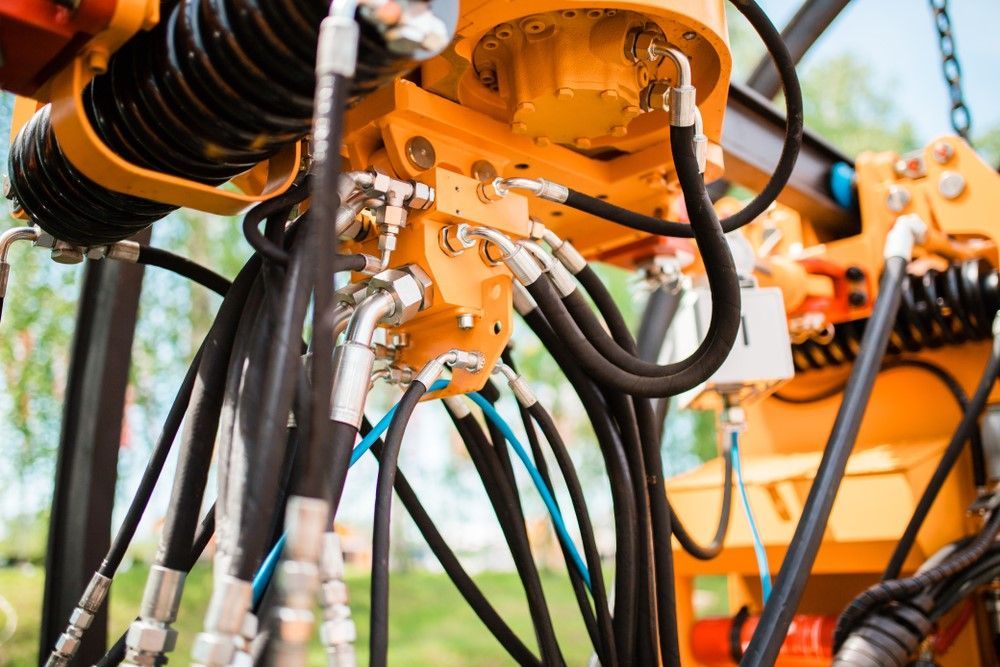 A close up of a machine with hydraulic hoses on it — HI PSI Hydraulics in Kempsey, NSW