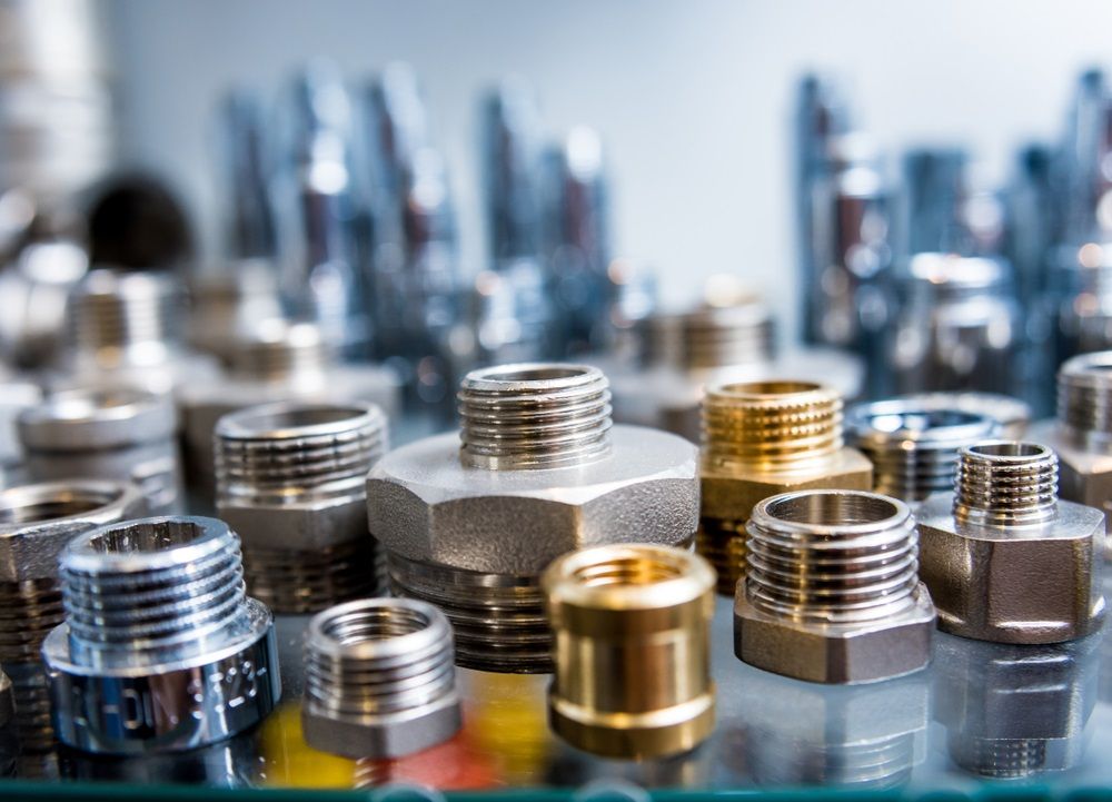 There Are Many Different Types Of Metal Fittings On The Table — HI PSI Hydraulics in South West Rocks, NSW