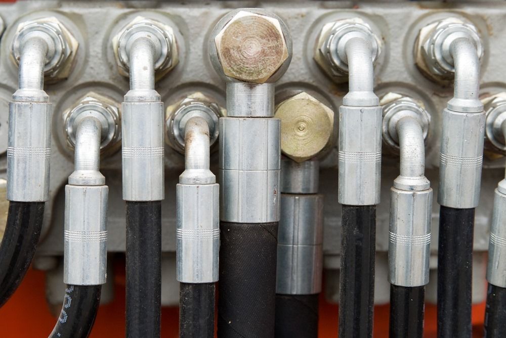 A Bunch Of Hydraulic Hoses Are Connected To A Machine — HI PSI Hydraulics in South West Rocks, NSW