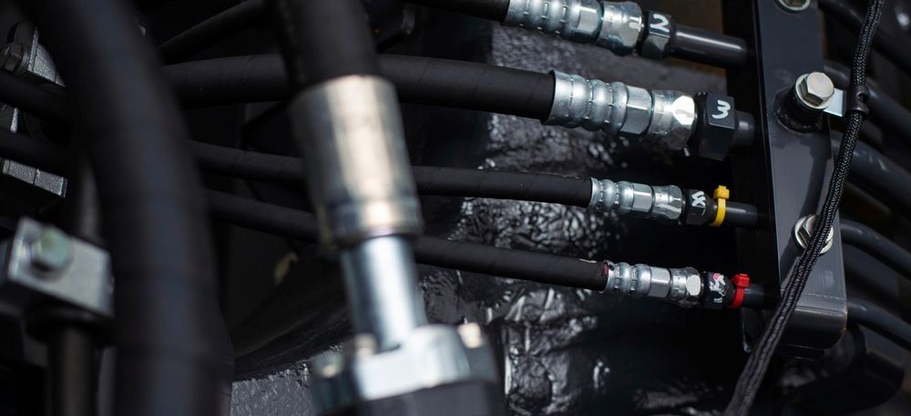 A Close Up Of A Bunch Of Hydraulic Hoses On A Machine — HI PSI Hydraulics in Macksville, NSW
