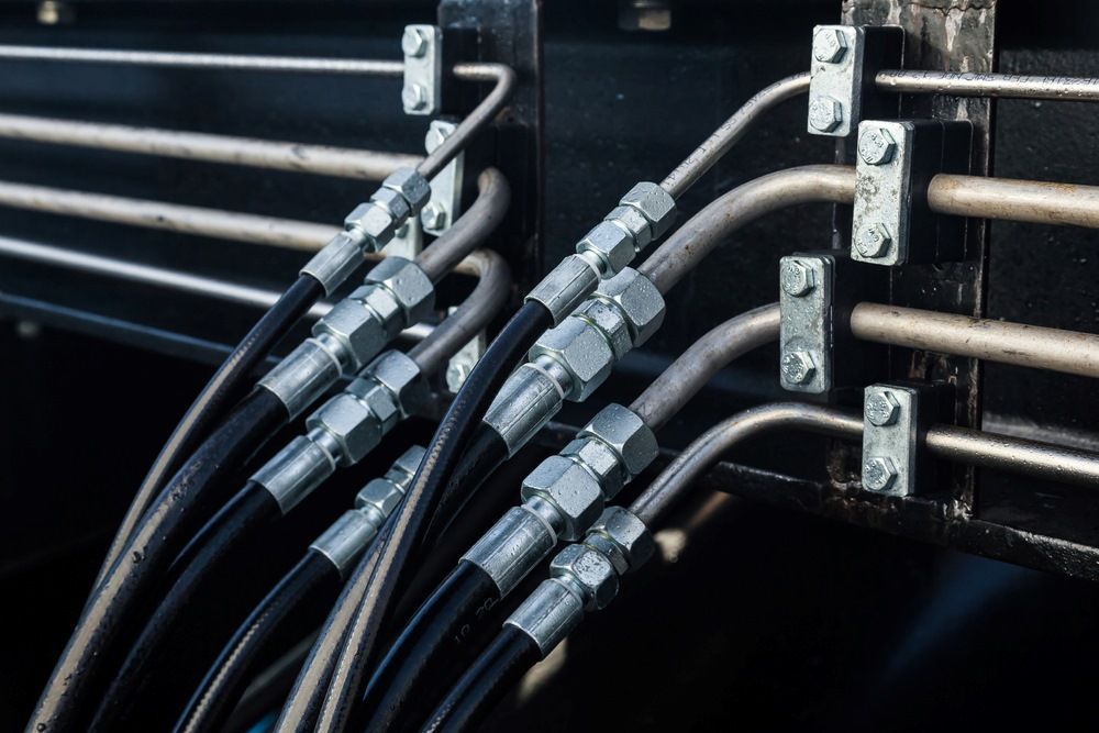 A Bunch Of Hydraulic Hoses Are Connected To A Machine — HI PSI Hydraulics in Harrington, NSW