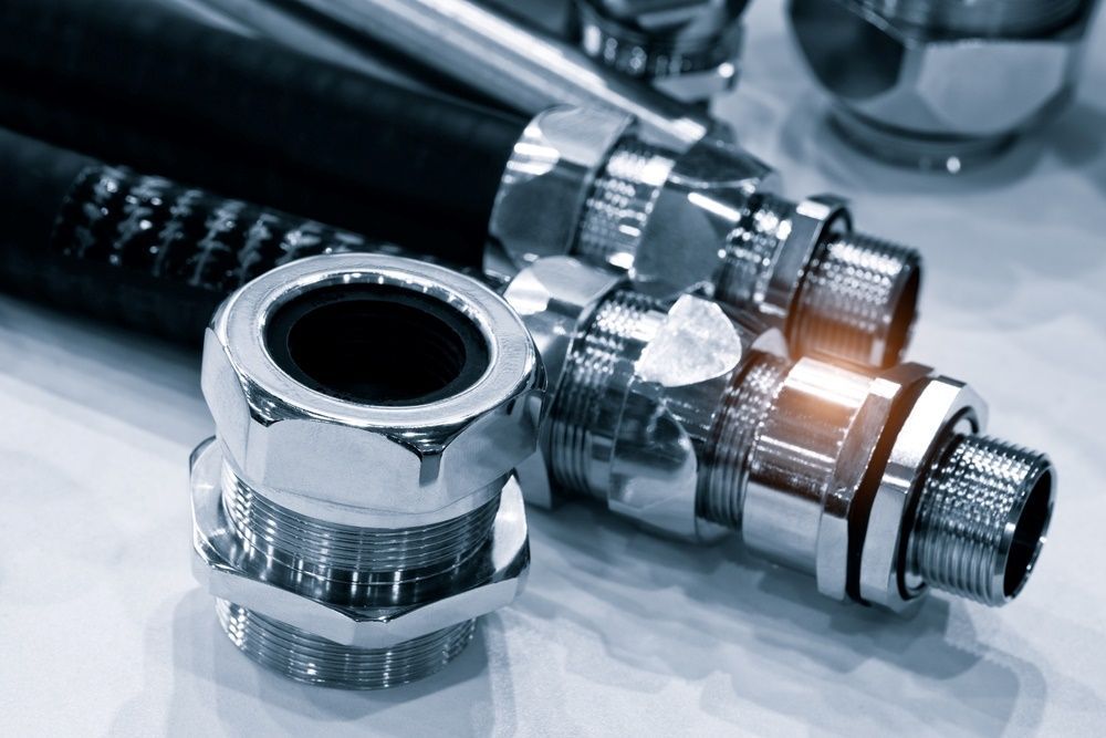 A Close Up Of A Hose And Connectors On A Table — HI PSI Hydraulics in Taree, NSW