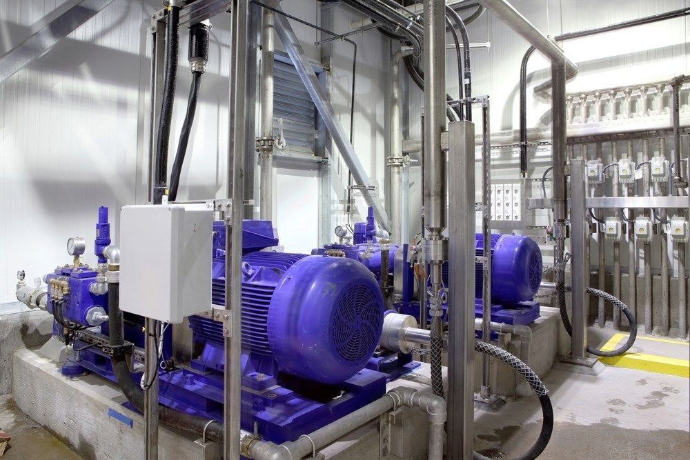 A Room Filled With Lots Of Electrical Equipment And Pumps — HI PSI Hydraulics in Taree, NSW