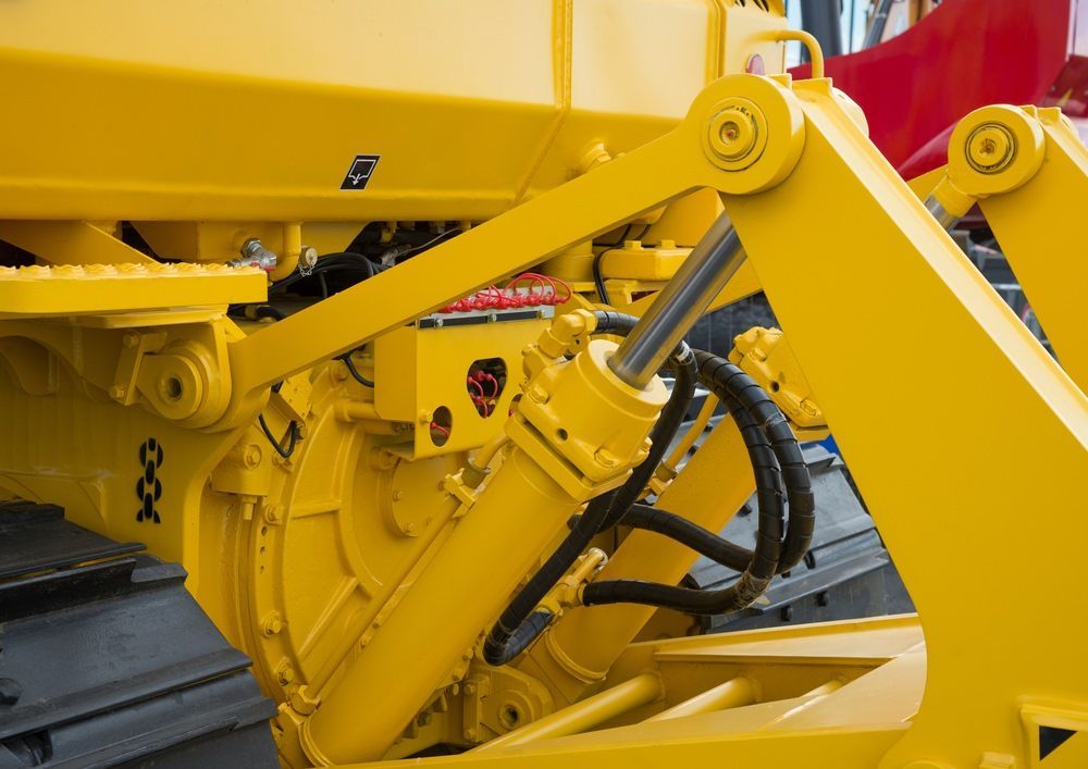 A Close Up Of A Yellow Hydraulic System On A Machine — HI PSI Hydraulics in Forster, NSW