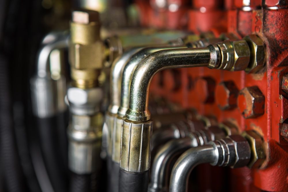 A Close Up Of A Bunch Of Hydraulic Hoses On A Machine — HI PSI Hydraulics in Wauchope, NSW