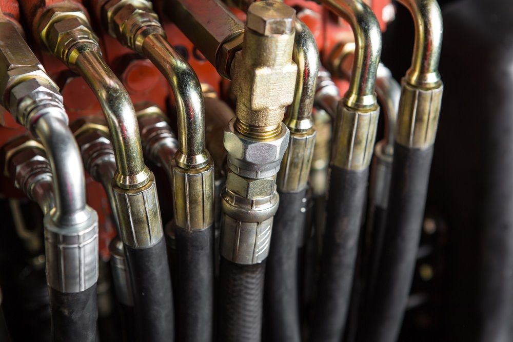 A Bunch Of Hydraulic Hoses Connected To A Machine — HI PSI Hydraulics in Wauchope, NSW