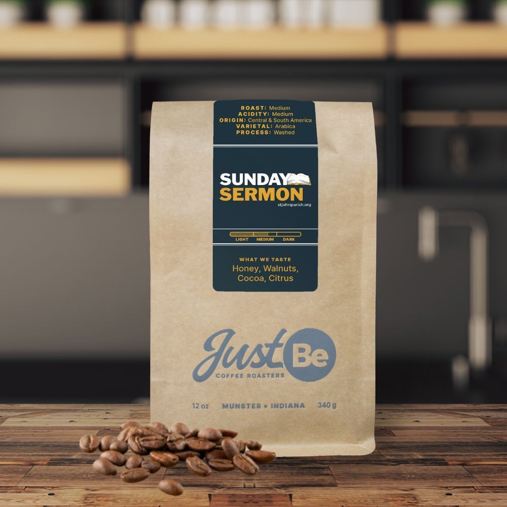 A bag of sunday sermon coffee beans sits on a wooden table