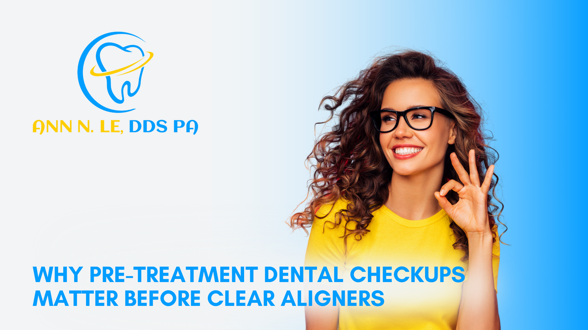 A woman wearing glasses and a yellow shirt is smiling and giving an ok sign.