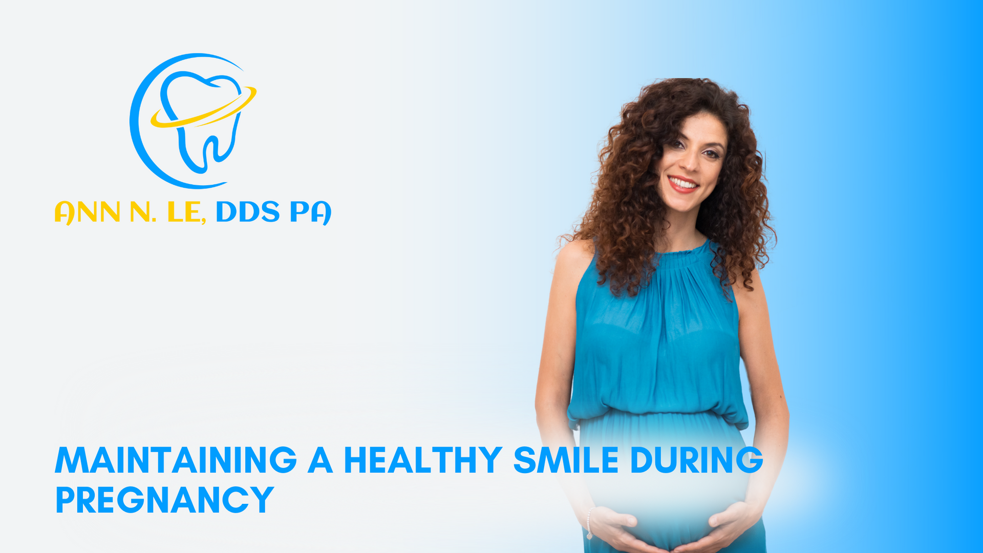 A pregnant woman is smiling and holding her belly.