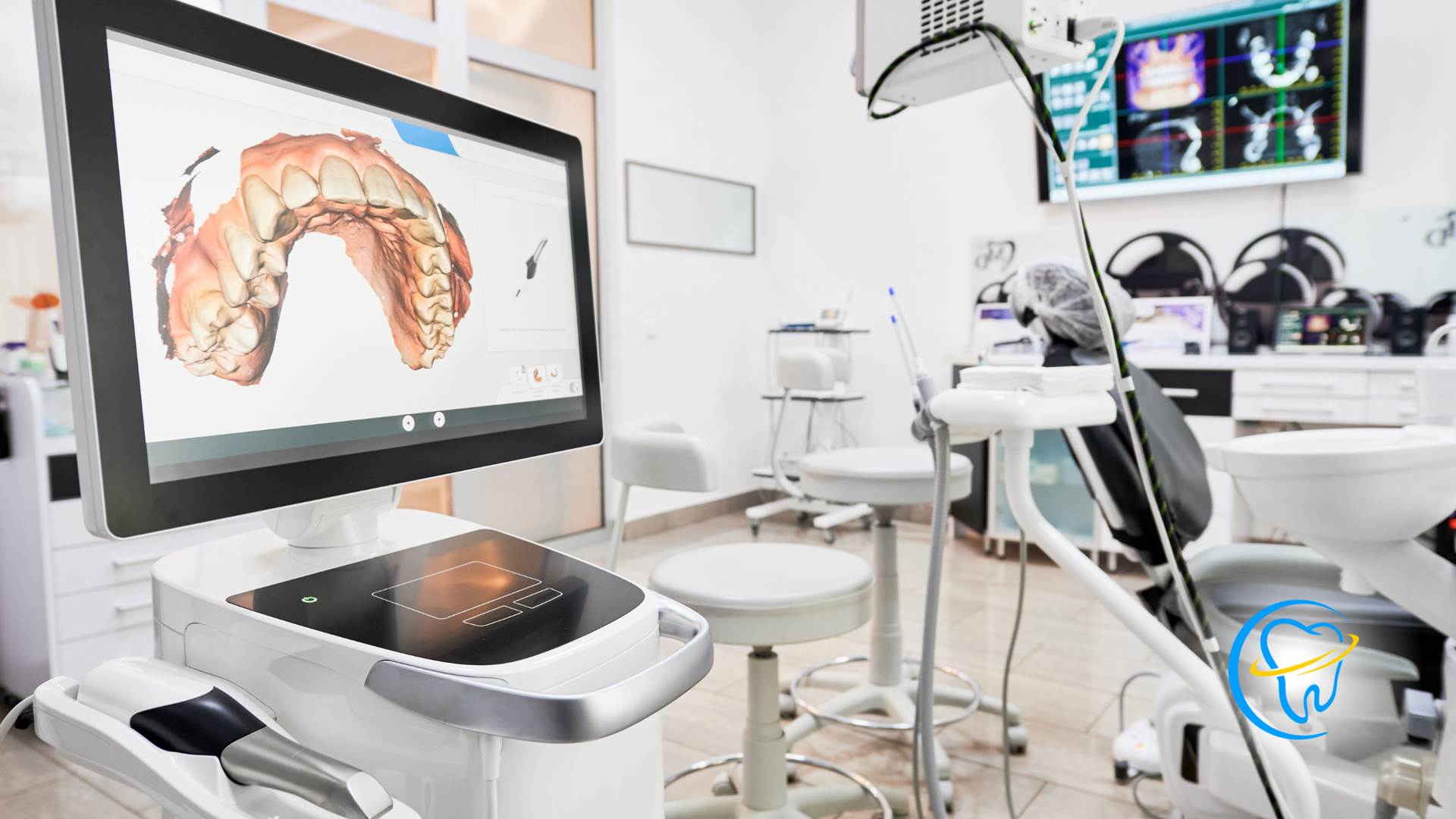 A dental office with a computer and a dental chair.