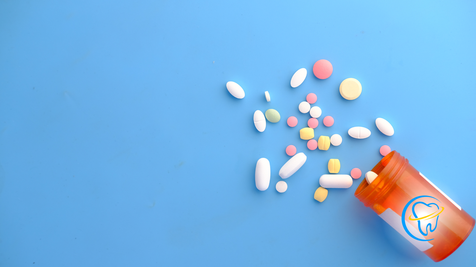 A bottle of pills is pouring out of it on a blue background.