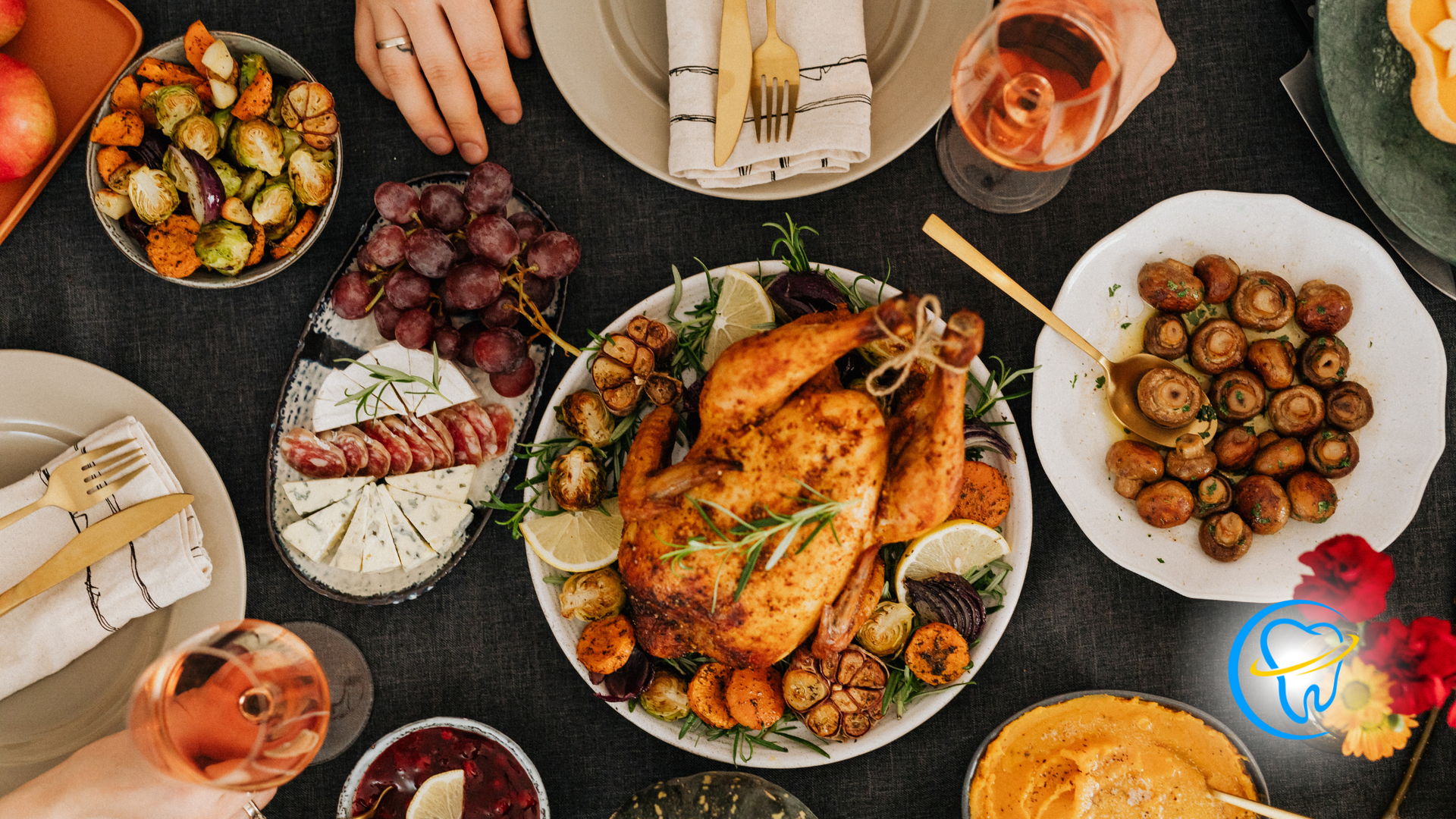 A table topped with plates of food and glasses of wine.