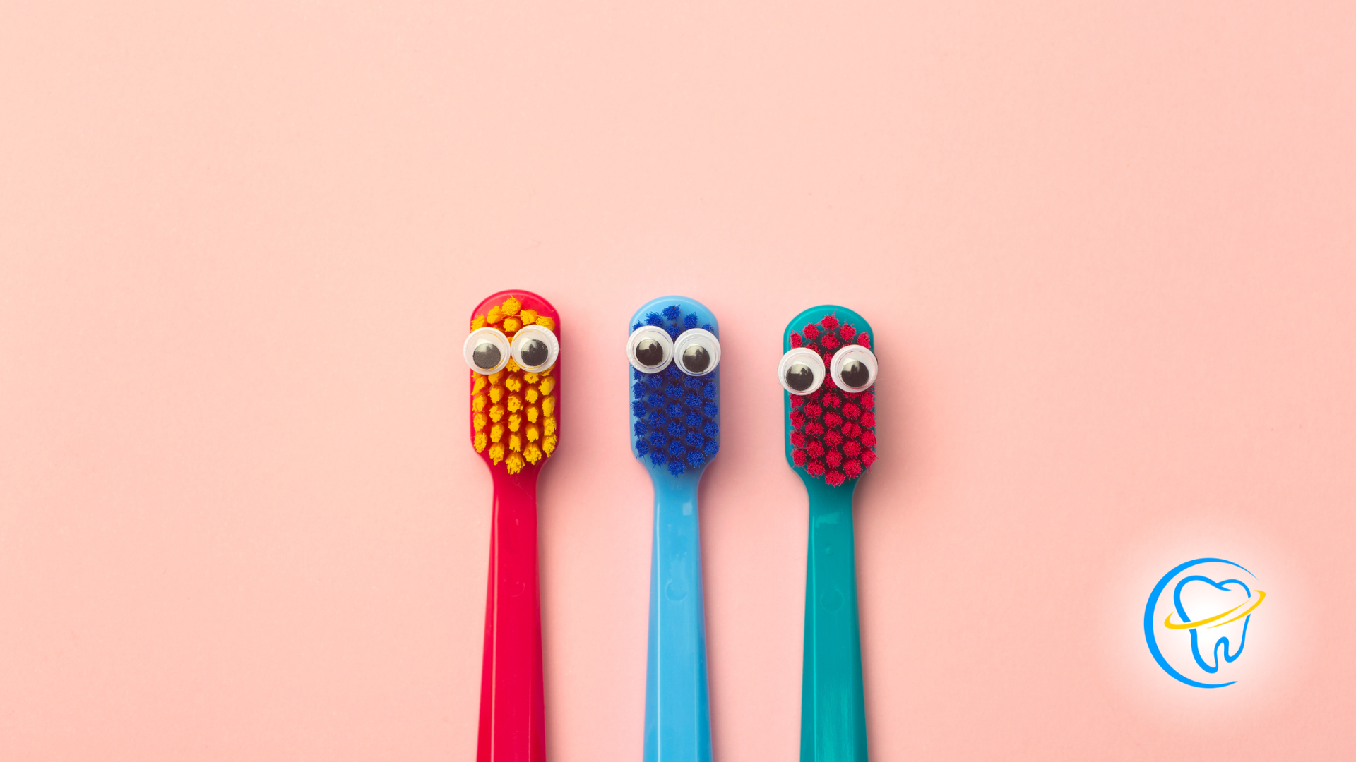Three colorful toothbrushes with googly eyes arranged on a pink background.