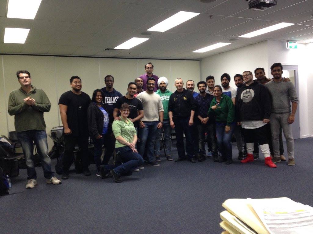 A group of people are posing for a picture in a room