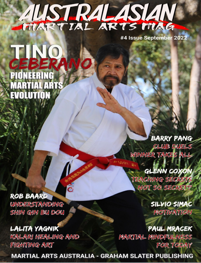 A man in a karate uniform is on the cover of a martial arts magazine.