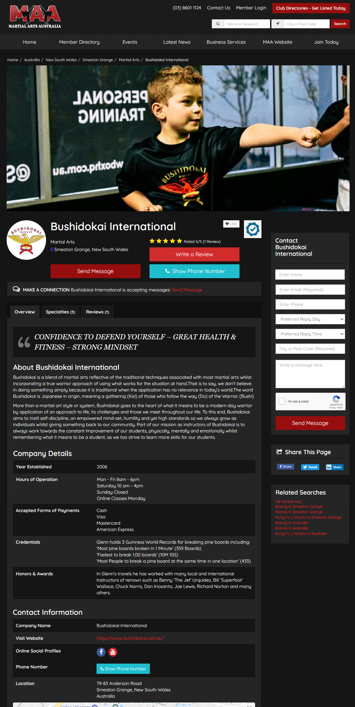 A boy is standing in front of a window on a website.