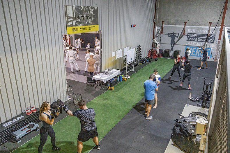 A group of people are boxing in a gym.