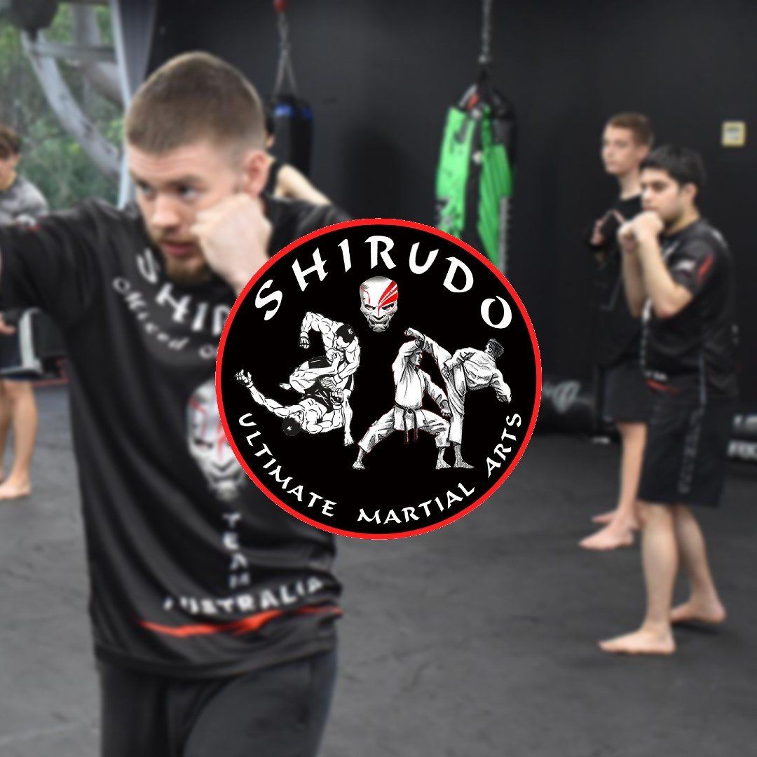 A group of men are practicing martial arts with the logo for shirudo ultimate martial arts