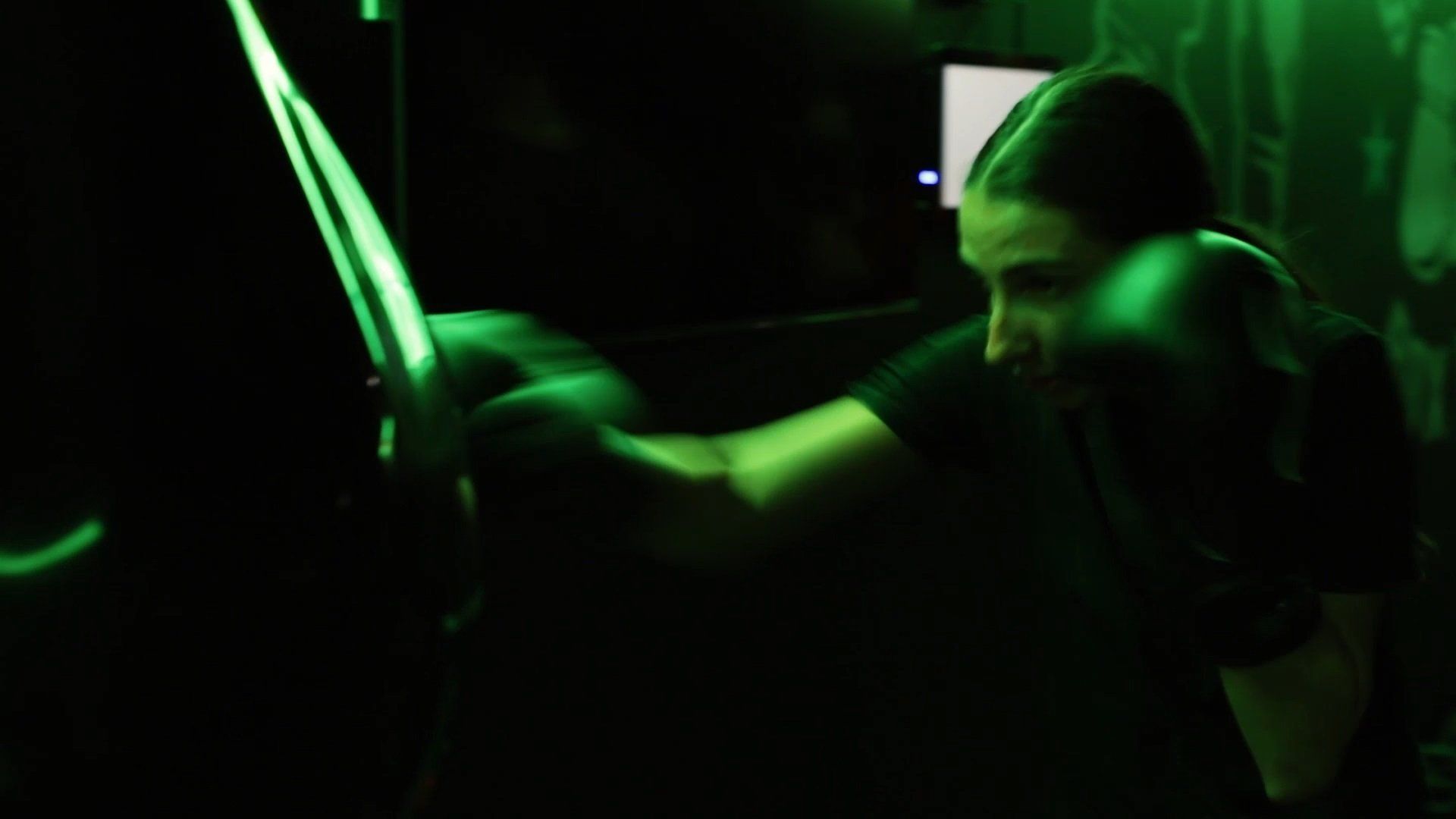 ShadowBoxHQ fitness class with green lighting effects