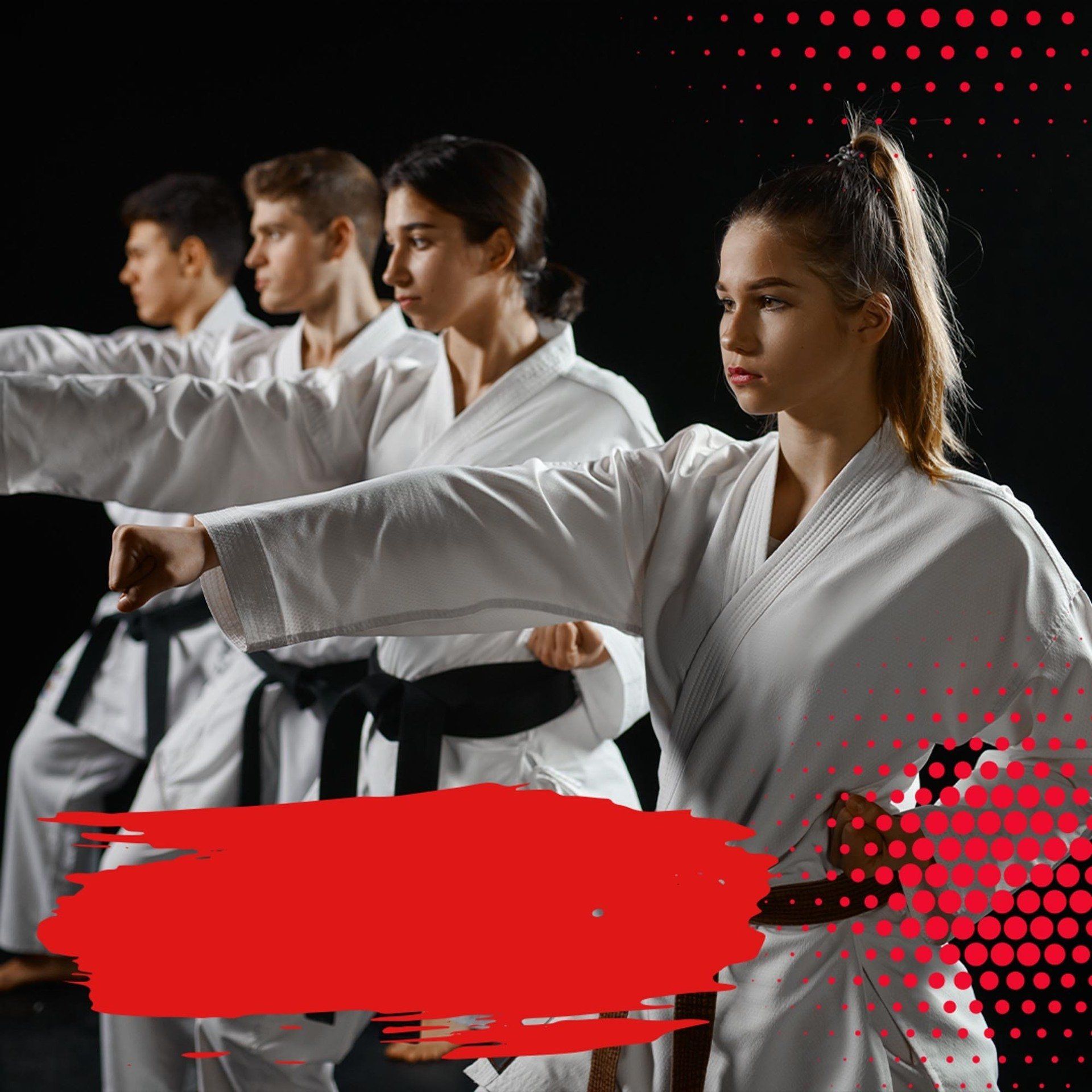 A group of people are practicing karate in a gym.