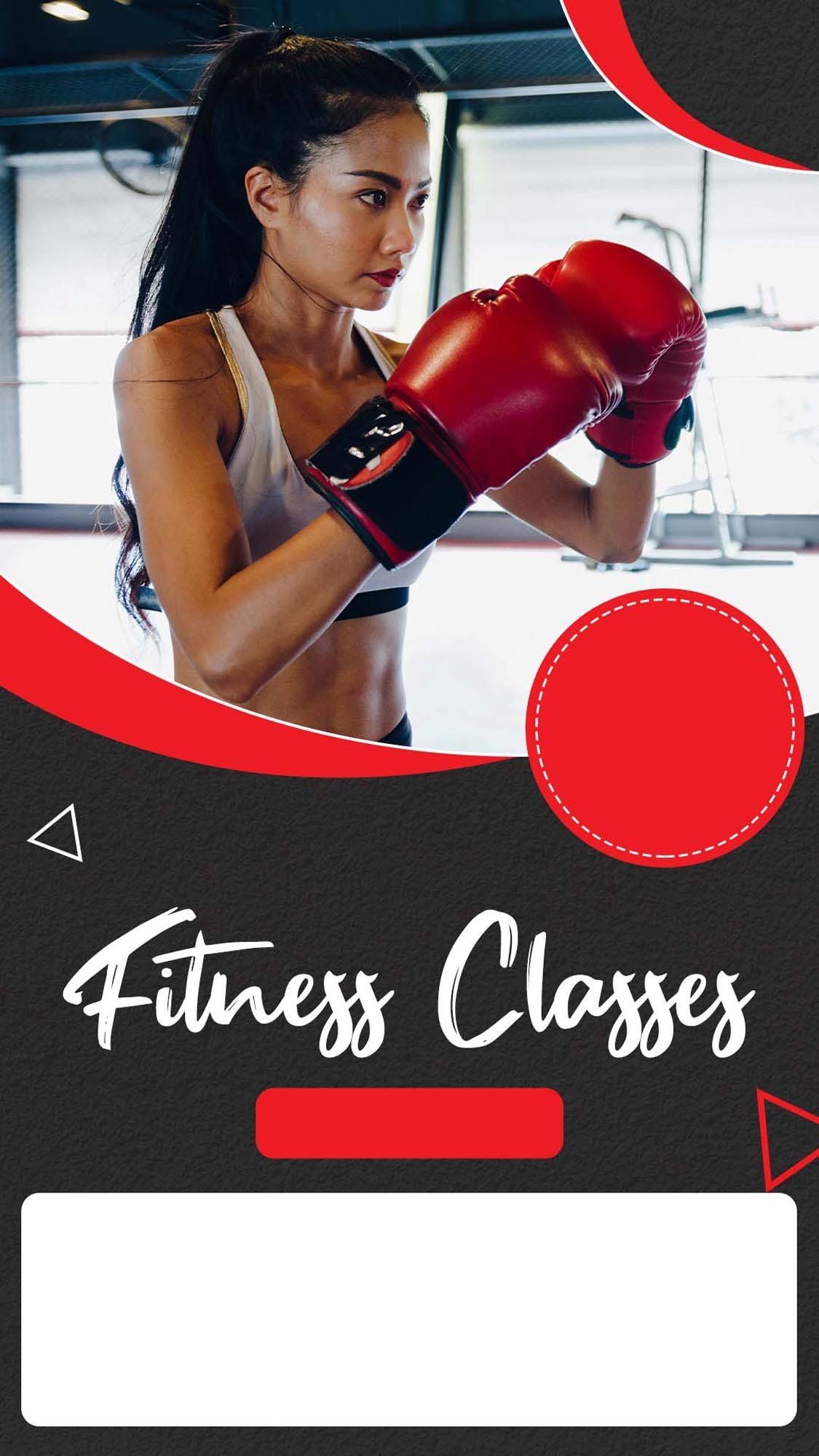 A woman is wearing boxing gloves in a gym.