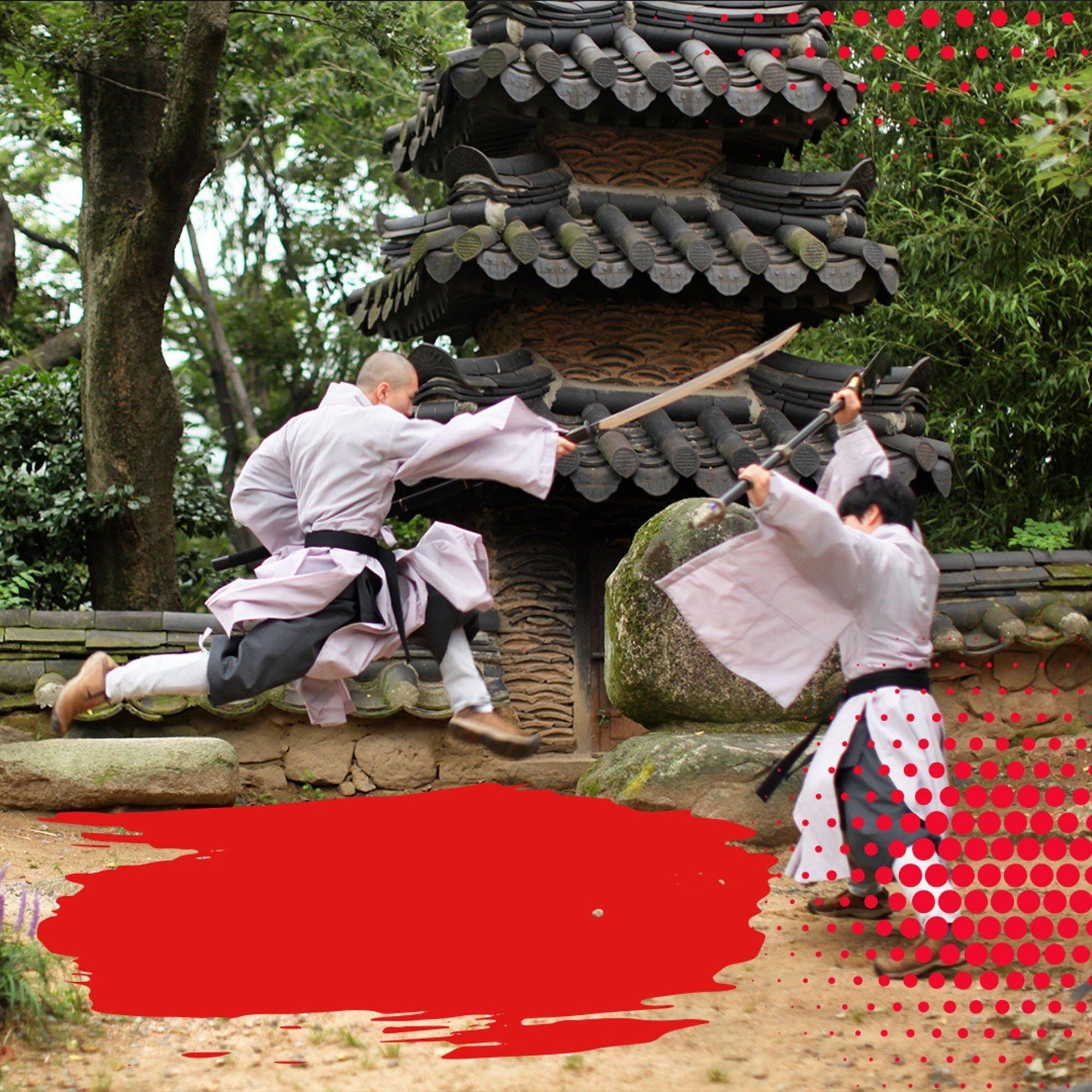 Two men are jumping in the air with swords in their hands