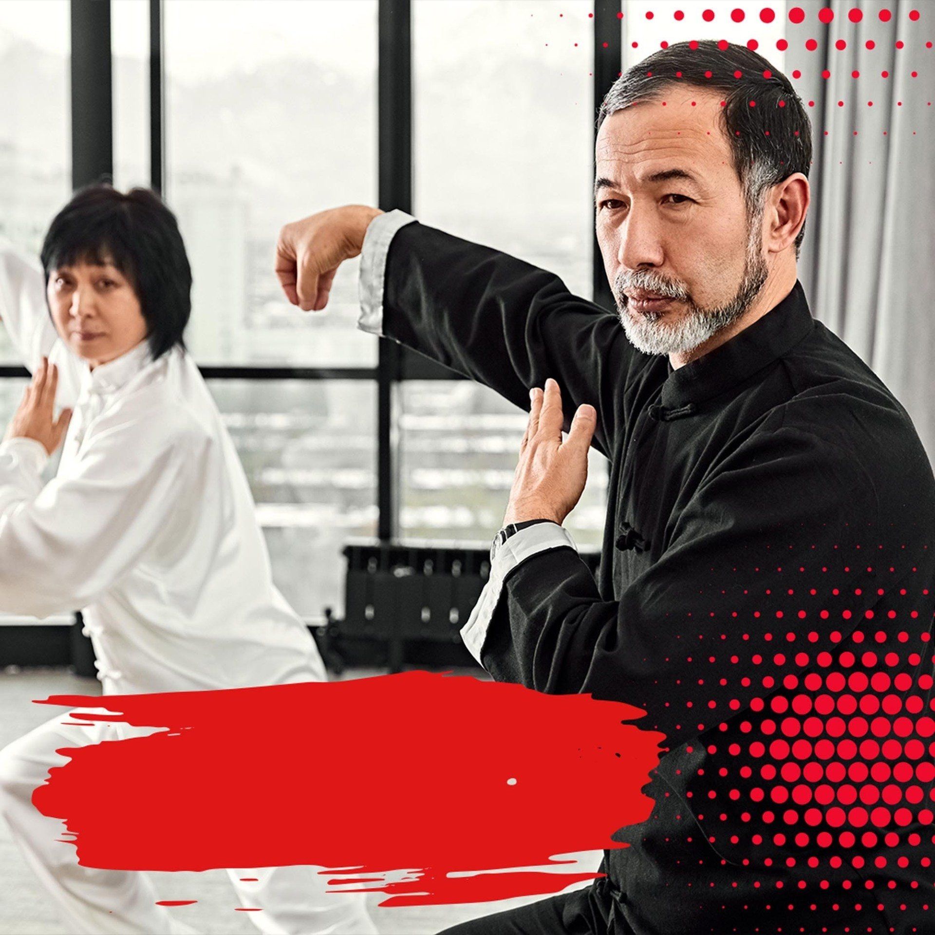 A man and a woman are practicing martial arts in front of a window.