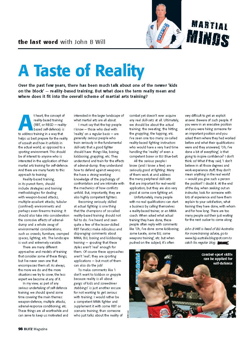 A newspaper article about martial arts with a picture of two men fighting.