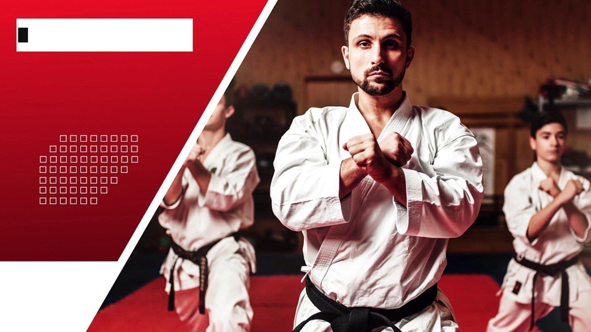 A group of people are practicing karate in a gym.