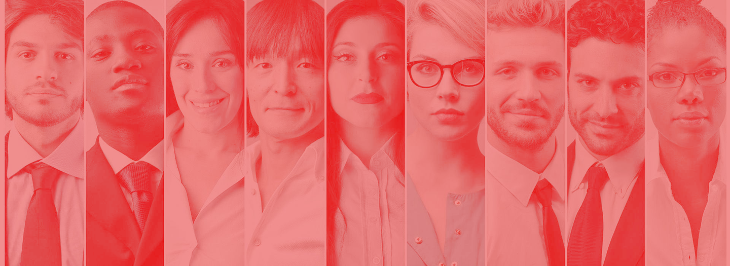 A group of people are standing next to each other in a row.