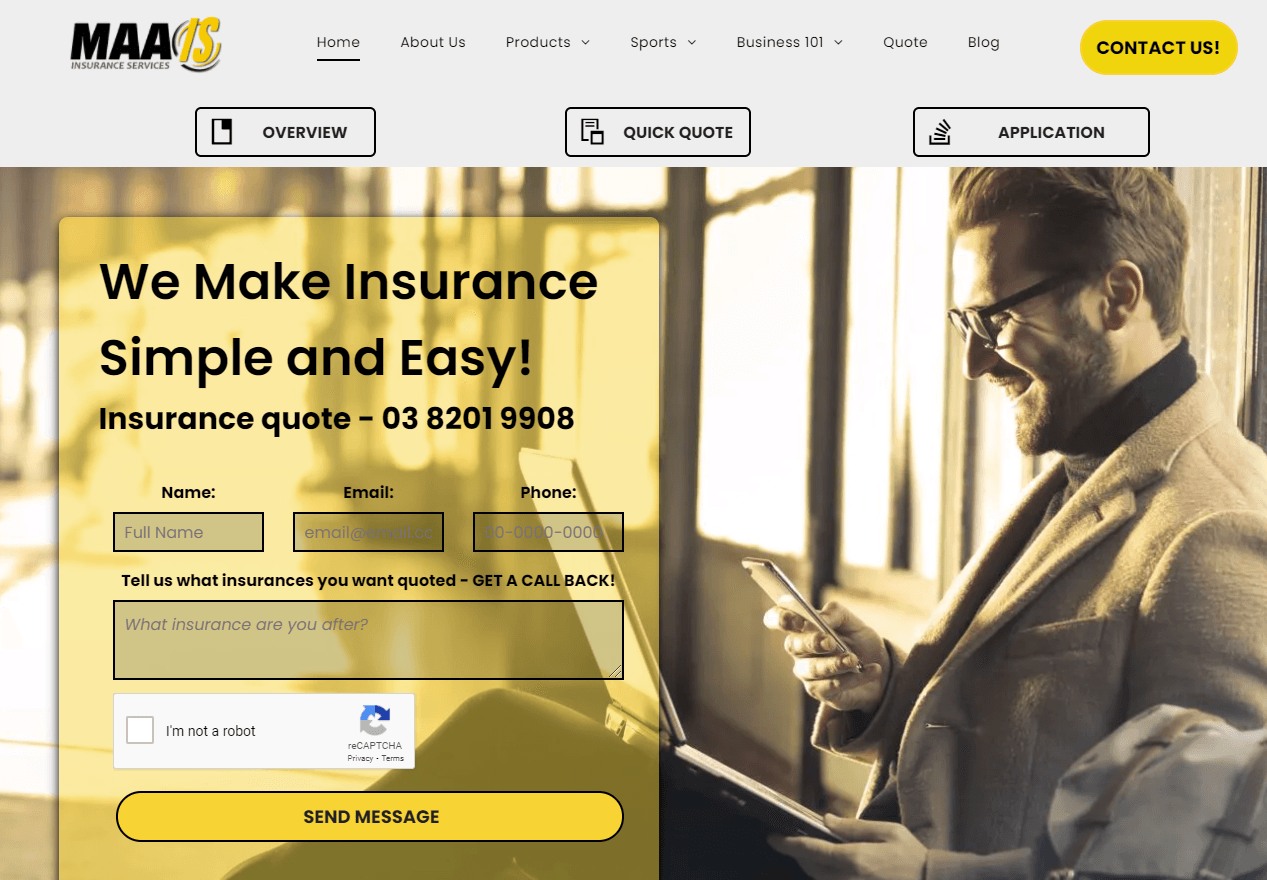 A man in a suit is holding a tablet and a cell phone.