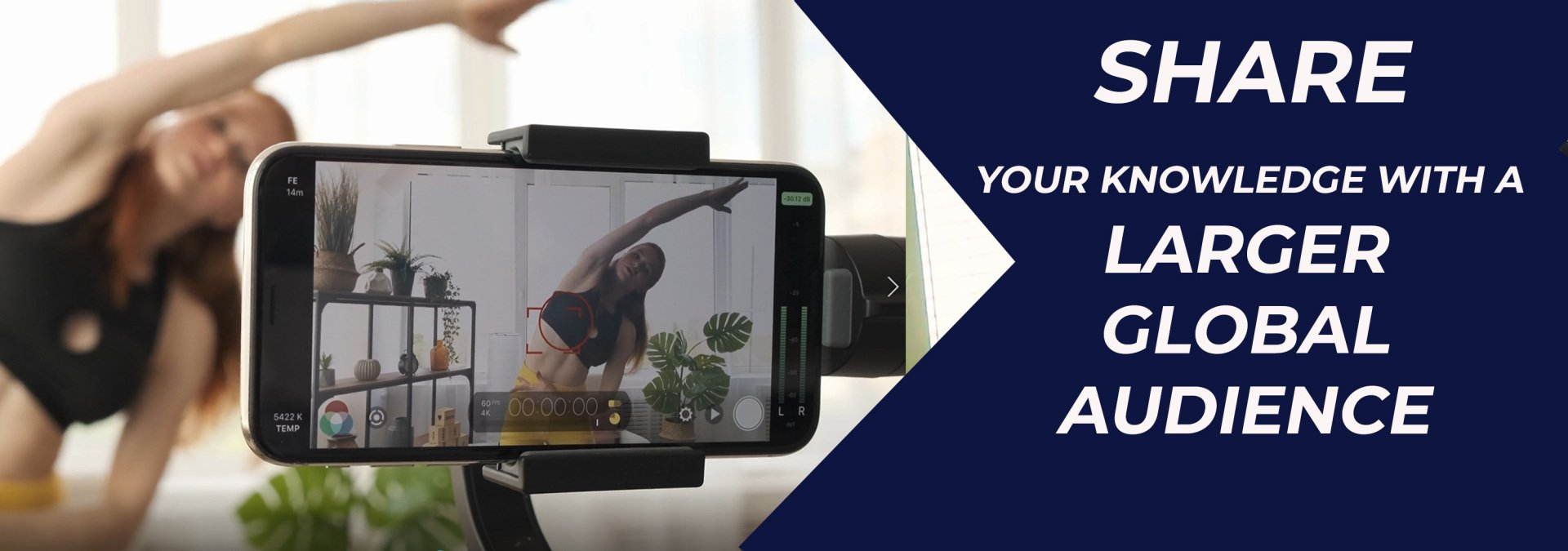 A woman is doing yoga while being filmed on a cell phone.