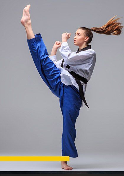 Teen martial artists practicing drills