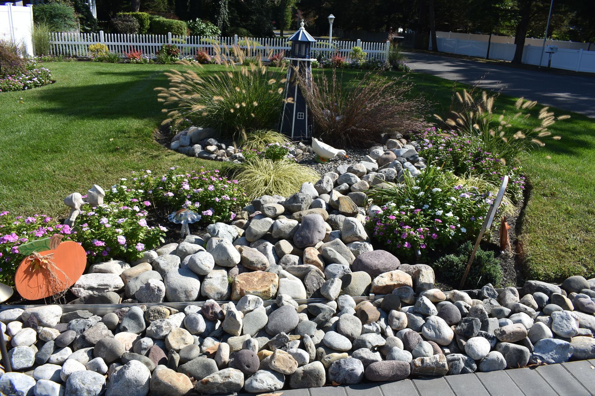 A garden with a lot of rocks and flowers in it
