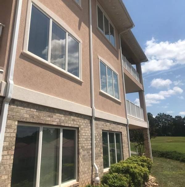 A large house with lots of windows and a balcony