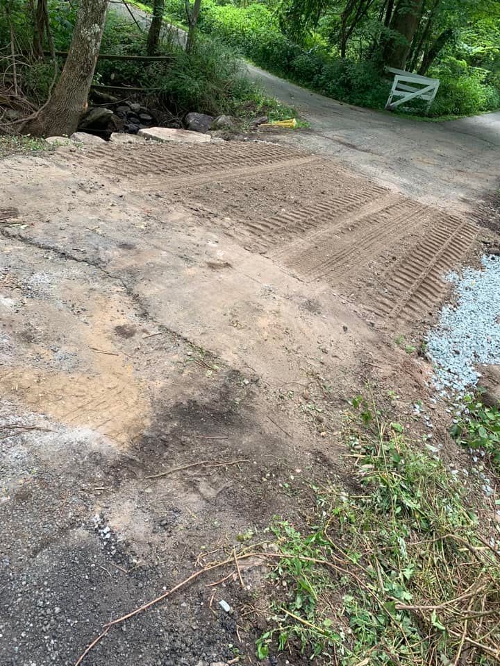 A dirt road with a lot of dirt on the side of it.