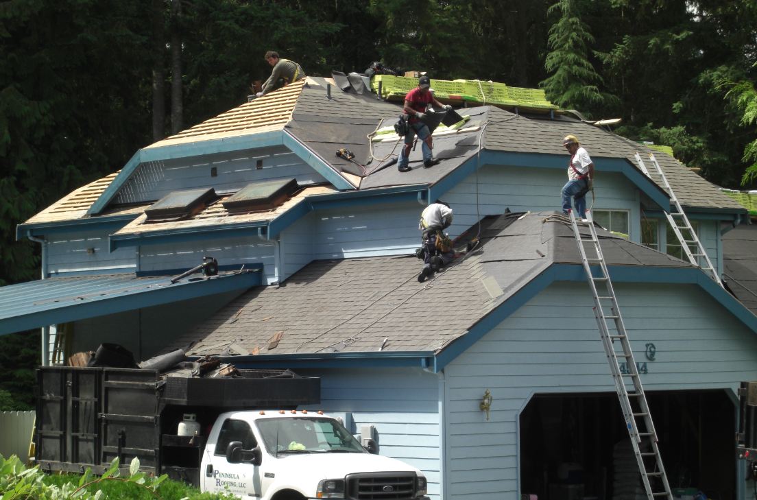 Repairman on Roof — Olalla, WA — Peninsula Roofing LLC