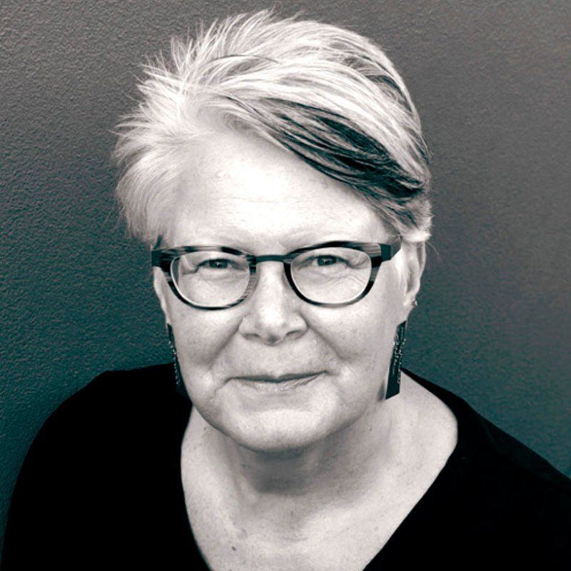 Robin Wilson, a woman with short hair and glasses
