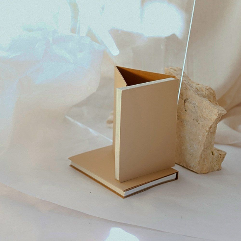 two hand stitched notebooks with kraft paper covers, made by Hey Jude (Alexandra Strong)