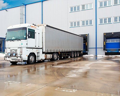 Women’s Apparel Stretch Garment — Unloading Big Container Trucks in Los Angeles, CA