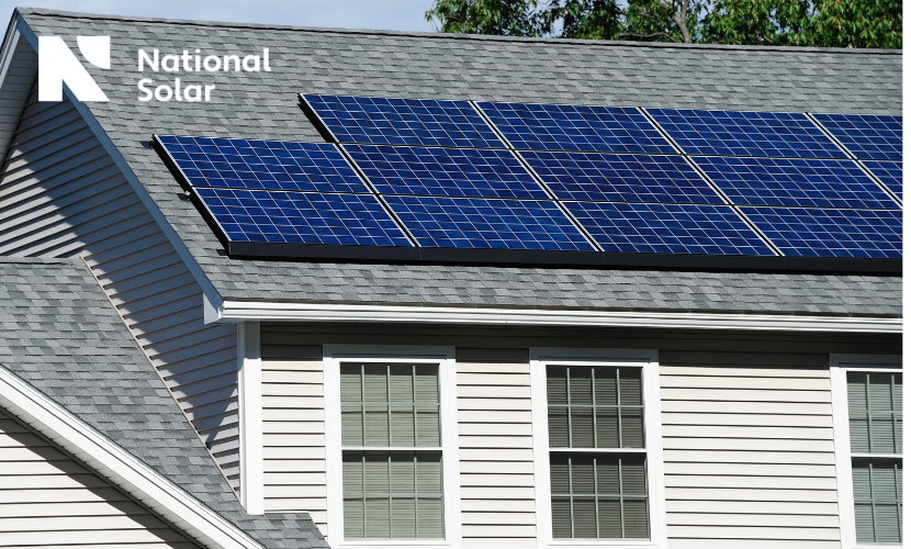 A house with solar panels on the roof and a national solar logo