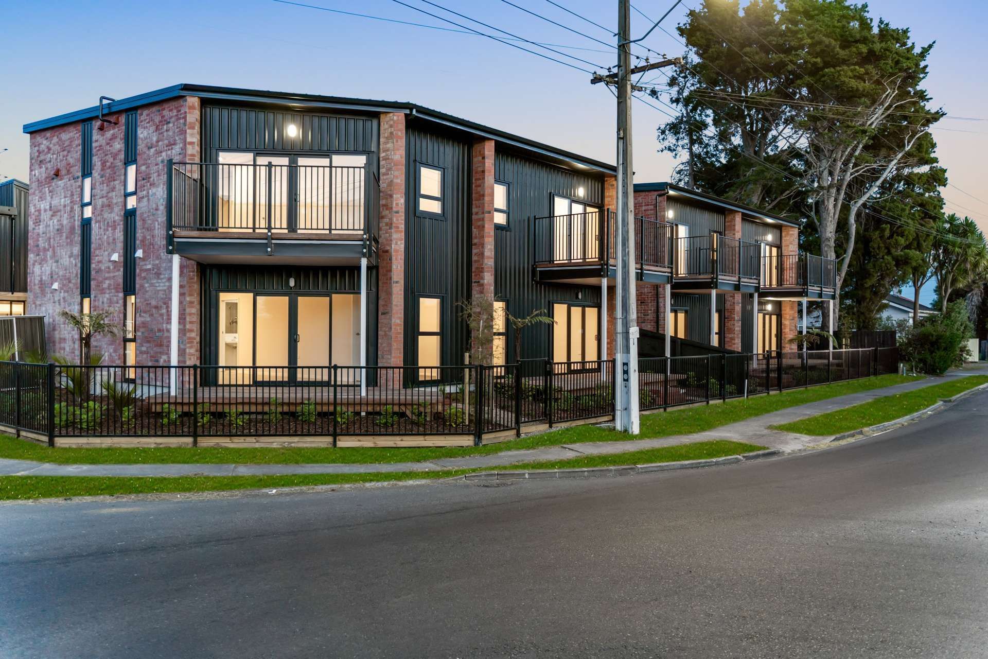 Townhouses with brick and black exterior.