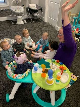 caregiver play with the babies