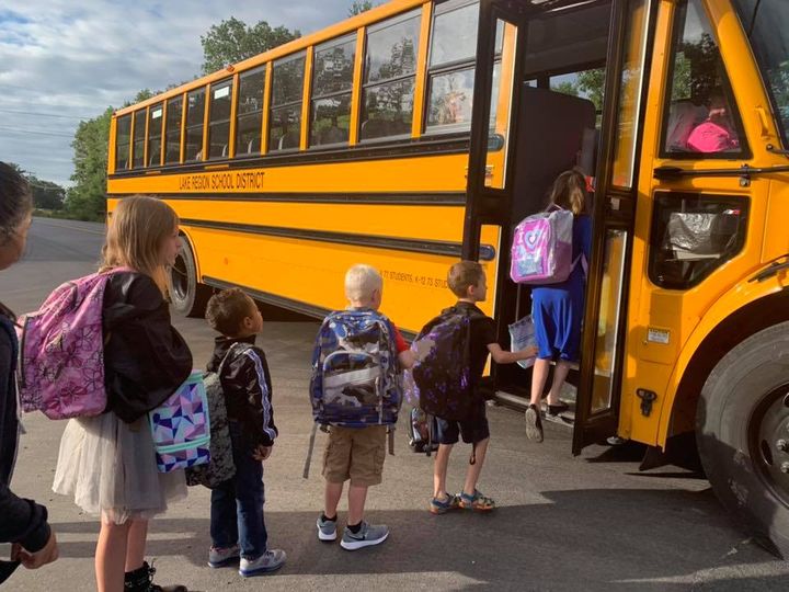 children going to school bus