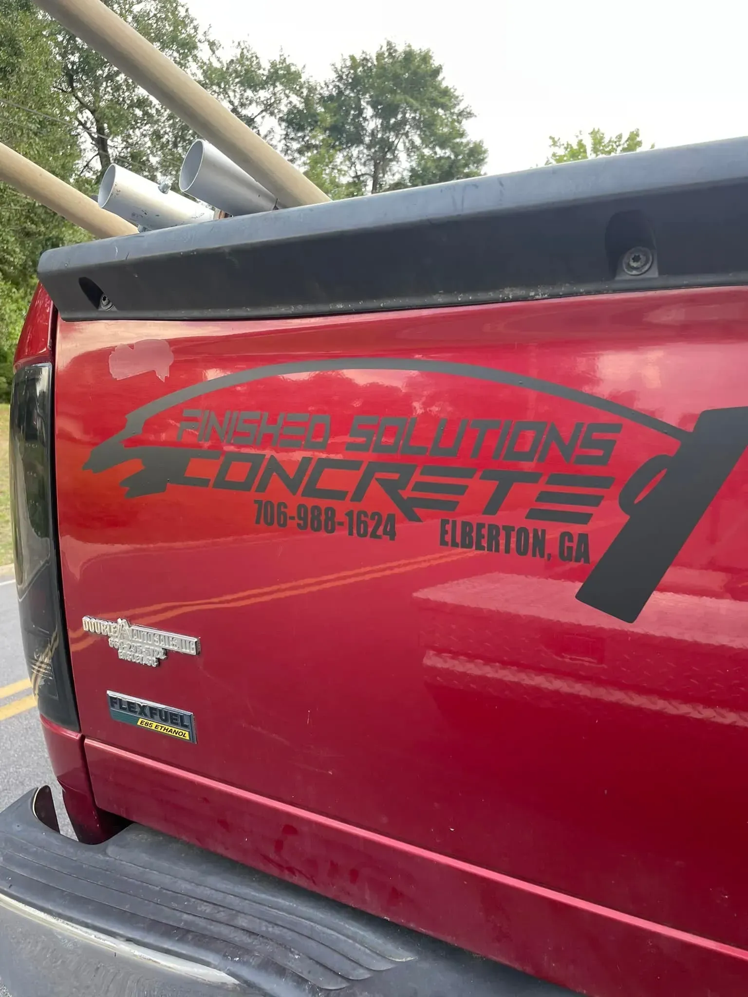Red truck bed with black logo: 