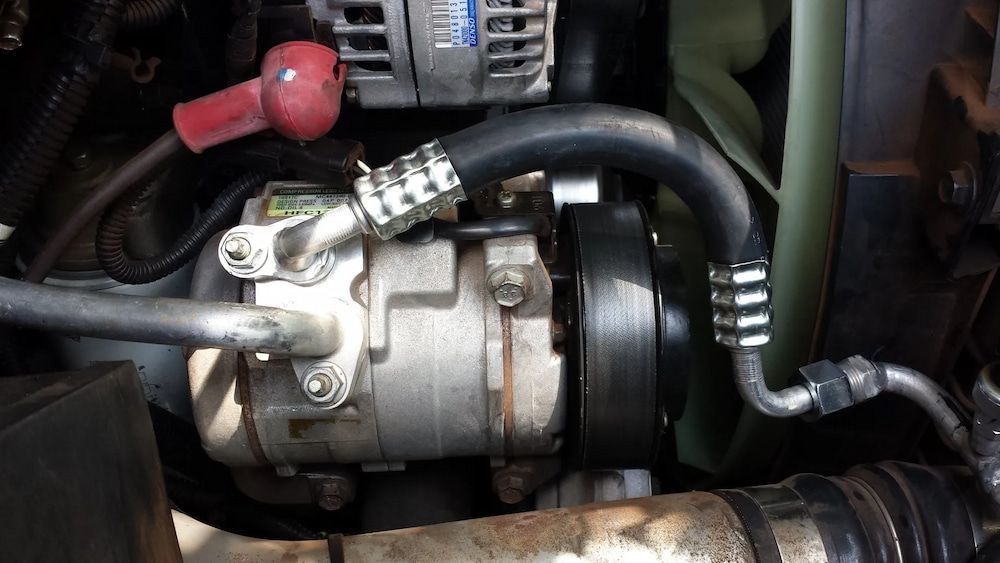 Car Engine With an Air Conditioning Compressor — Cool Cars NT in Anula, NT