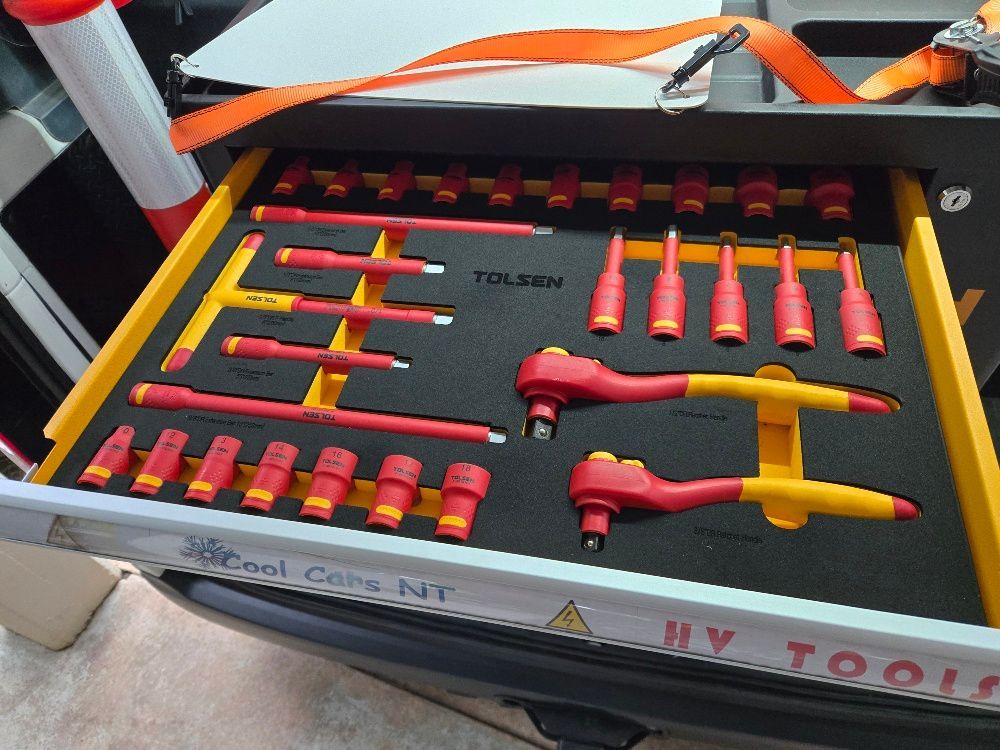 Open drawer of tools organized on yellow trays, including red and yellow insulated sockets and ratchets. — Cool Cars NT in Anula, NT